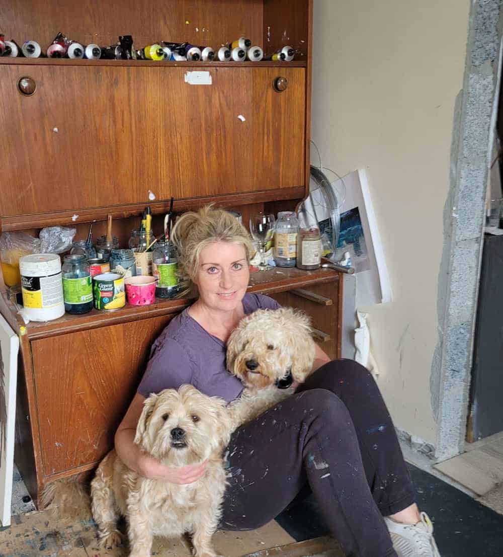 Una O Grady in her studio with her two dogs
