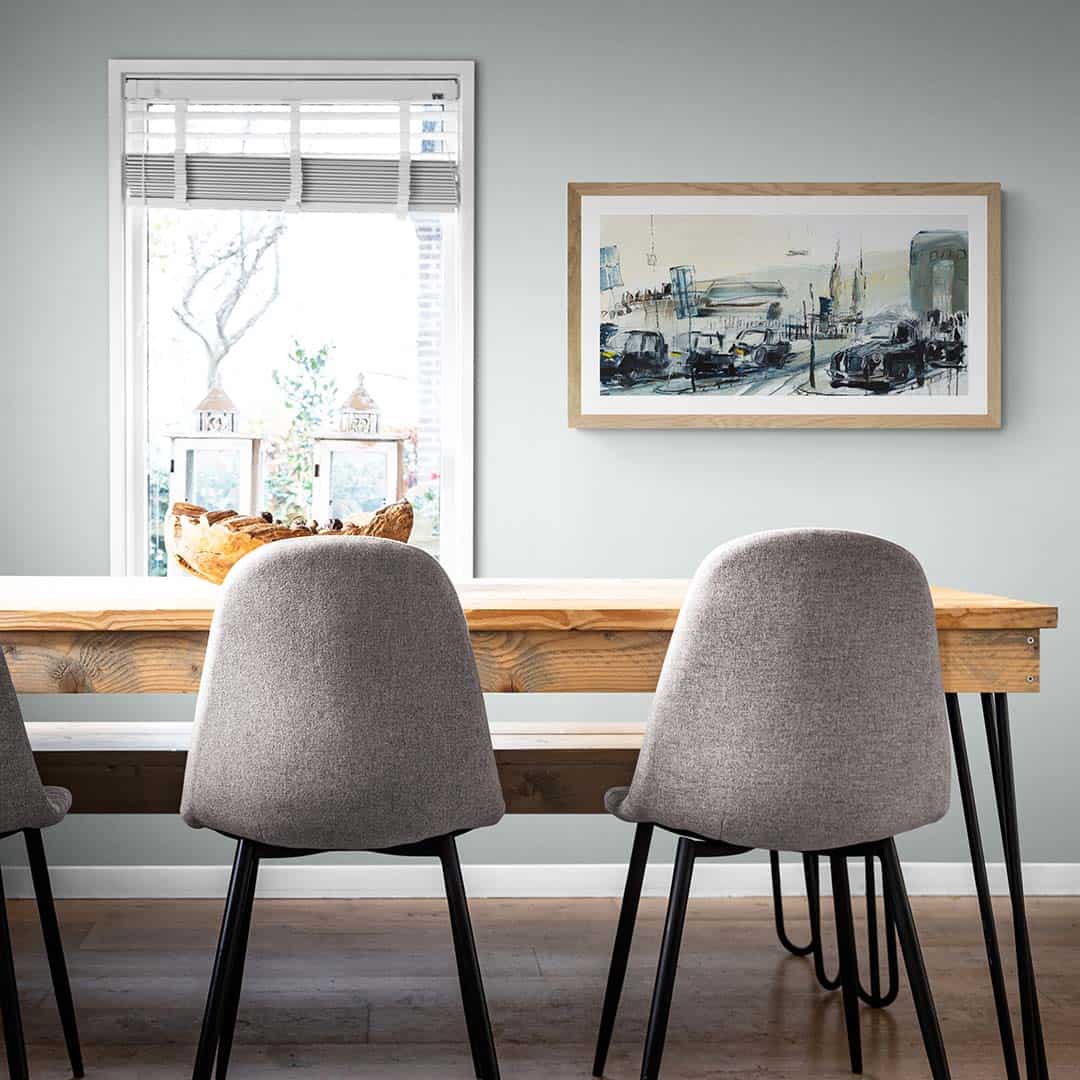 Taxis At Milfield painting hanging in dining room and wooden table -- Una O Grady Paintings